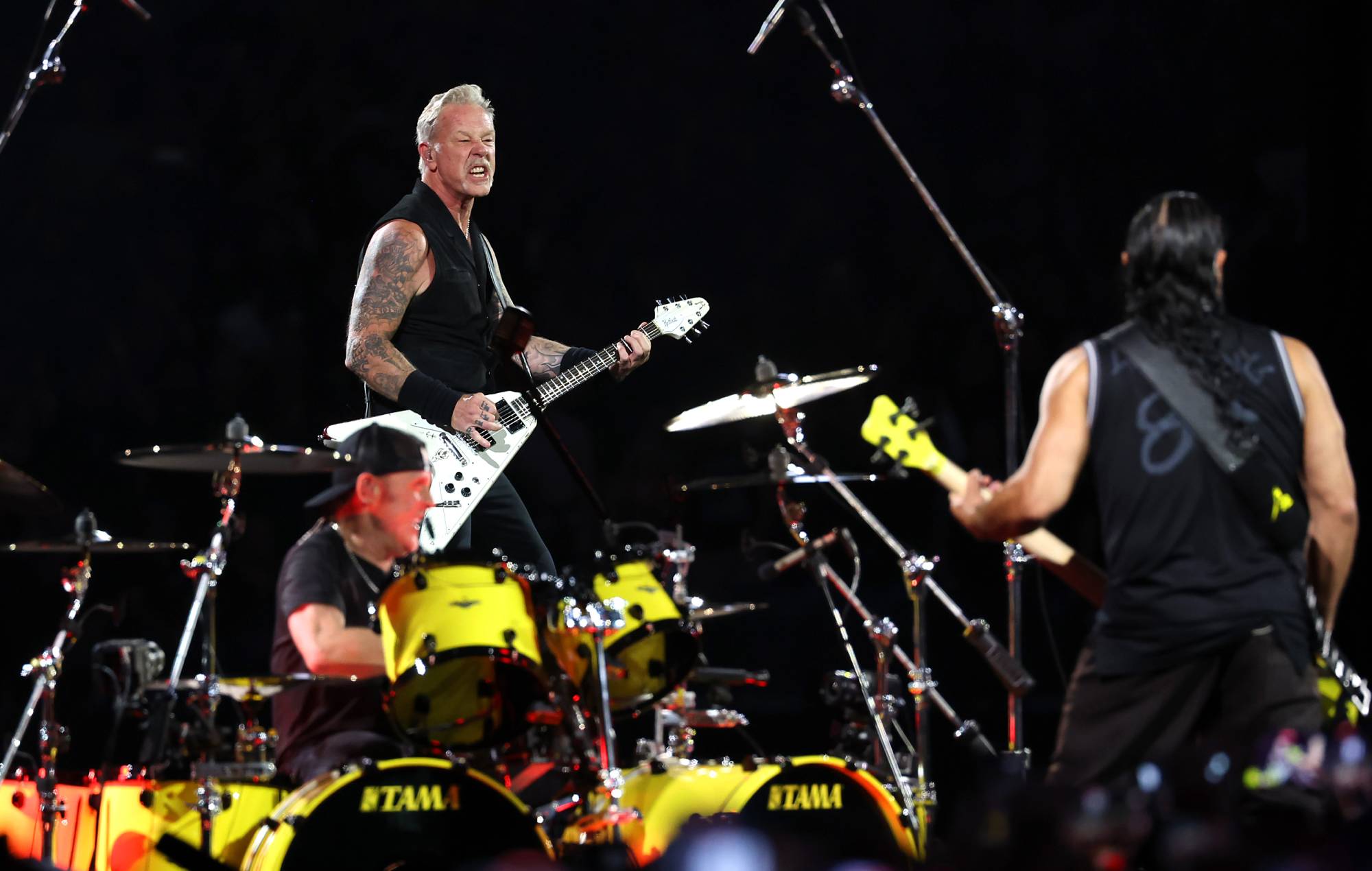 Lars Ulrich, James Hetfield and Robert Trujillo of Metallica perform onstage at SoFi Stadium on August 25, 2023 in Inglewood, California. Credit: Monica Schipper/Getty