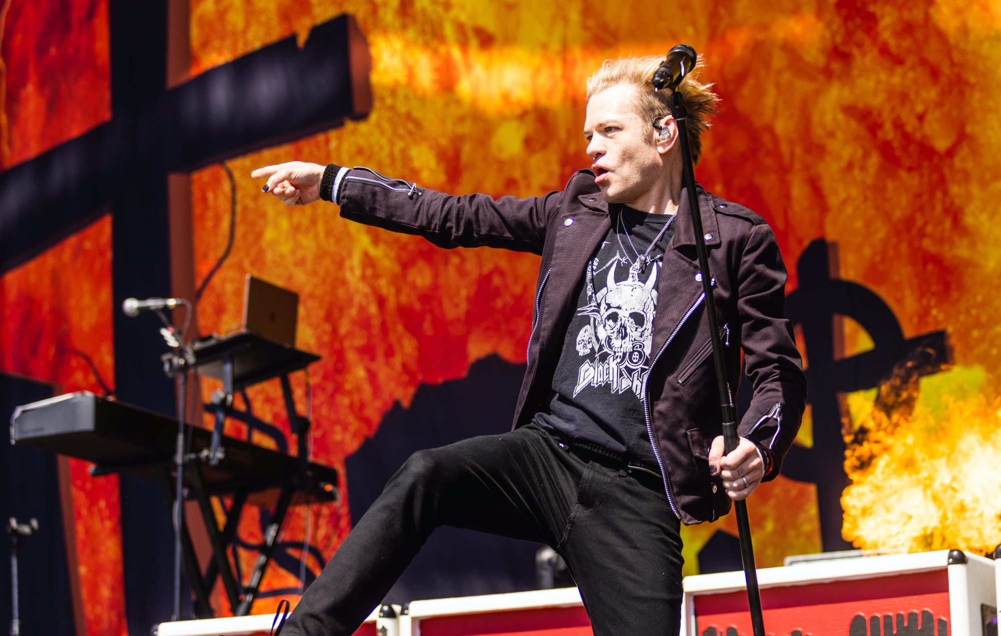 Deryck Whibley performing live on stage with Sum 41 in 2023
