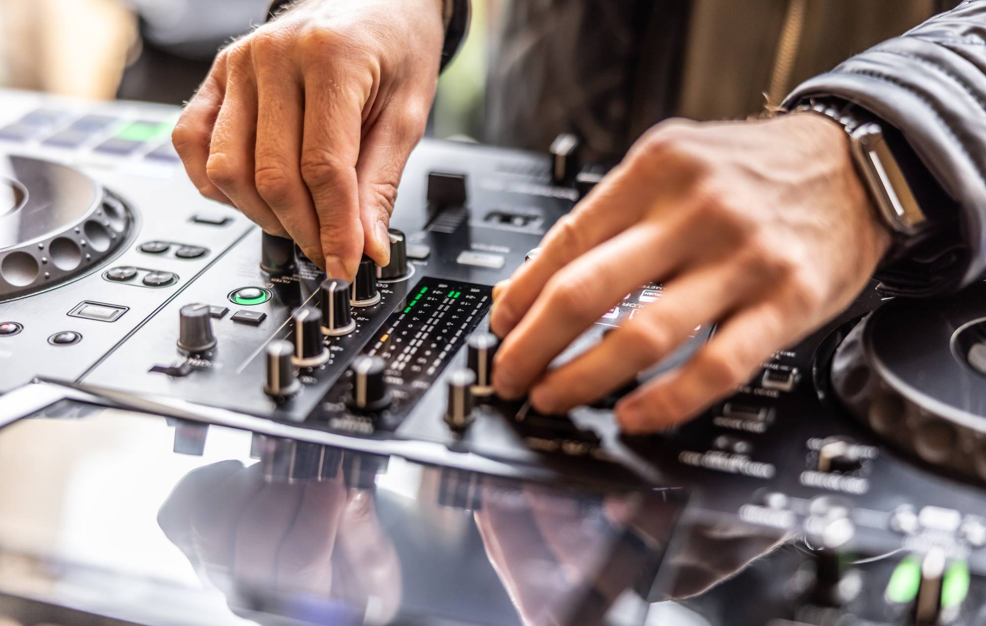DJ hands mixing music for a night club party Credit: SimpleImages via GETTY
